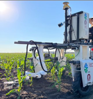 Agricultural robot inserting sensors into cornstalks